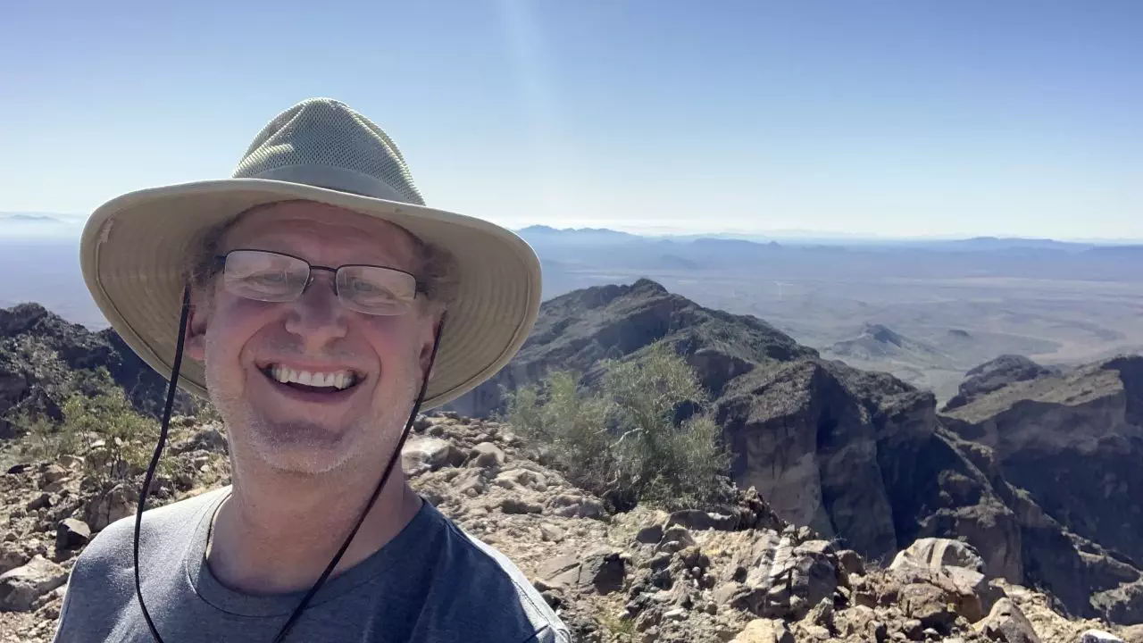 A selfie of Shea Oliver on the summit of saddle Mountain